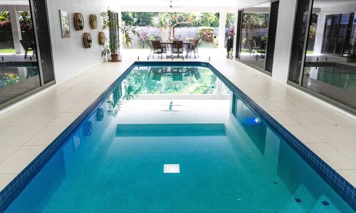 Trinity Beach Villa | Luxury Tropical Escape: Beachside Villa with Heated Pool & Modern Comforts