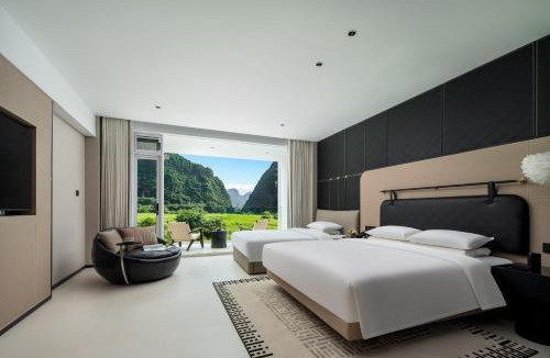 Yangshuo Hotel | 阳朔山野集宿度假酒店 遇龙河千古情店