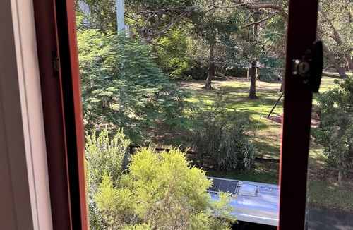 Bardon Apartment | Beautiful treehouse couples retreat 5kms from city with sauna, spa and pool