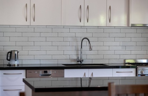 Wandiligong House | *BRIGHT* Modern Home with large outdoor deck and outside fireplace.