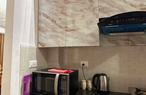 Noida Apartment | Charming 2-bedroom apartment with Pool View