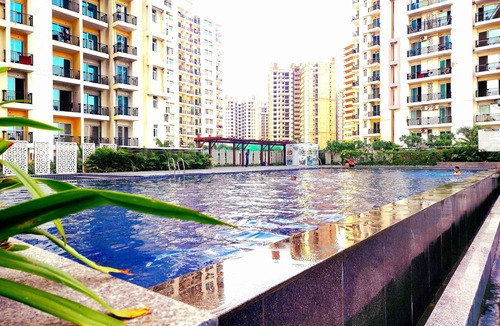 Noida Apartment | Charming 2-bedroom apartment with Pool View