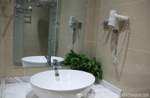 Jinghong Apartment | Doudou Meilan Fengqing Inn