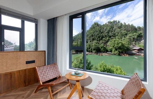 Fenghuang House | Feng Huang Riverside Courtyard Guesthouse-Butler Service-Paid ethnic minority batik clothing experience center,professional travel photography, fishing, hiking