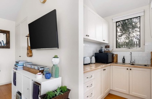 Bellbrae Apartment | Fireside Bliss Poolside Escape with Cosy Comforts