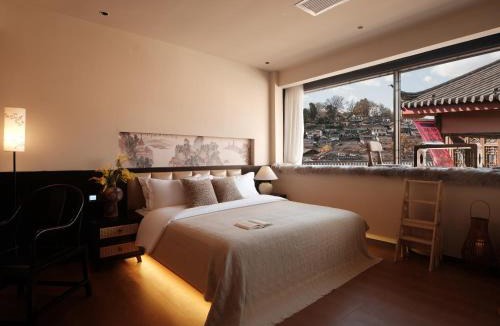 Dayan Old Town House | Lijiang Yunmuwan provides breakfast and afternoon tea, offers free airport shuttle service, The hotel provides a platform for visiting the ancient city and Yulong snow