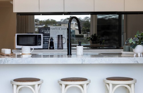 Oatley House | Luxurious Waterfront Retreat with Tennis Court