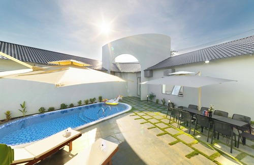 Tho Quang Beach Villa | Minimalist-style private villa with unique arched gatewat design & private pool