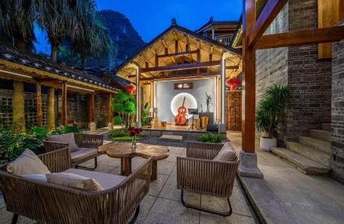Yangshuo House | Music Village - Ancient Courtyard Resort with Garden Cafe - Designed by a South African architect - Golden Dragon Parade