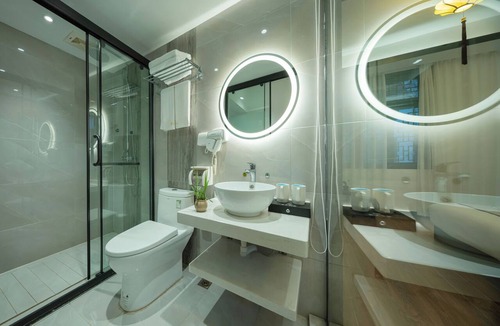 Fenghuang Hotel | Qixin Xianting Hotel