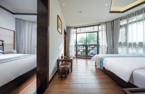 Fenghuang Hotel | Qixin Xianting Hotel