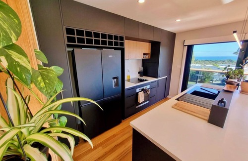 Carlton House | Sunset Sands Coastal Retreat with Sauna