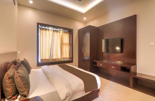 Auli Hotel | Super Townhouse Amaraa Farms Near LuLu Hypermarket