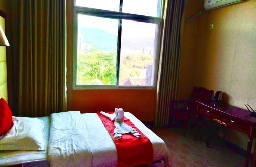 Jinghong Hotel | XiShuangBanNa International Aerial Garden South of Mekong River Business Hotel 傣江南商务酒店