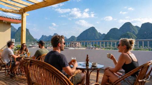 Yangshuo Hostel | Yangshuo Eden's Social Guesthouse - cozy garden courtyard & fresh craft coffee & night beers & outdoor activities