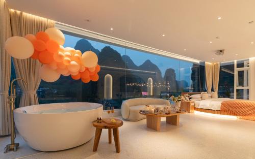 Ten Mile Gallery Hotel | Yangshuo MINOS Hotel-Inspired by Santorini design, Entrance of Ten-Mile Gallery,Free Laundry,Itinerary Hepler,Book Tickets in Advance,E Scooter Service