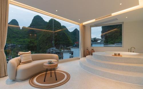 Ten Mile Gallery Hotel | Yangshuo MINOS Hotel-Inspired by Santorini design, Entrance of Ten-Mile Gallery,Free Laundry,Itinerary Hepler,Book Tickets in Advance,E Scooter Service