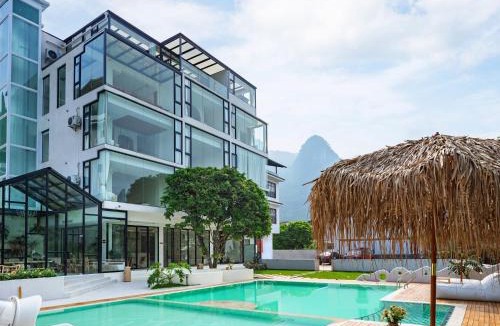 Yangshuo Hotel | Yangshuo OrangeWhite Resort - An Exclusive Cave - Inspired Haven by the River - Featuring Panoramic Mountain Views-Infinity Pool & Alpaca Encounters & Tailor-Made Excursions