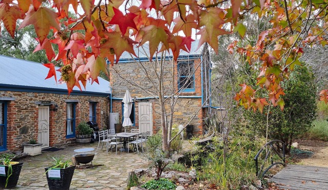 1890s stone hayloft overlooking beautiful gardens and courtyard.