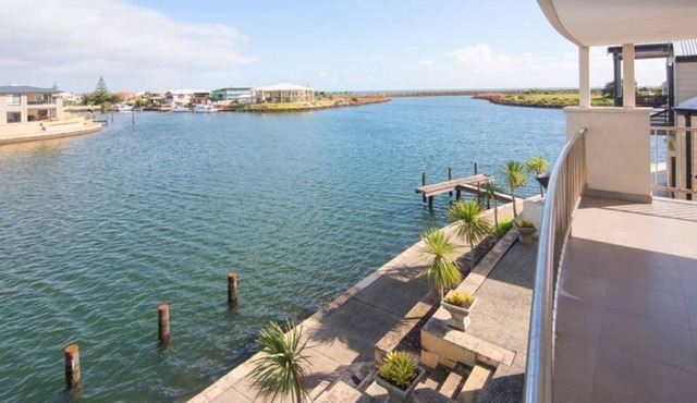 A two-story luxury home on the Port Geographe Canals