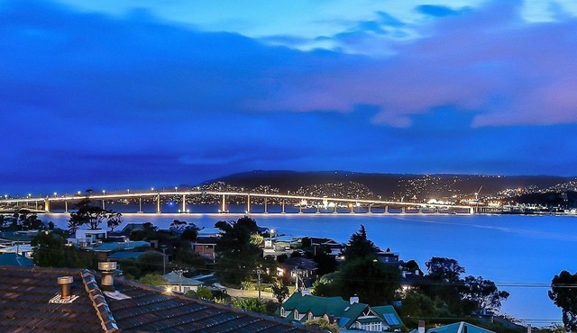 Deep Blue Wow views over river city mountain