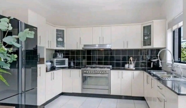 Family room with shared facilities kitchen, laundry, bathroom and living area.