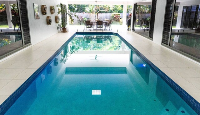 Luxury Tropical Escape: Beachside Villa with Heated Pool & Modern Comforts