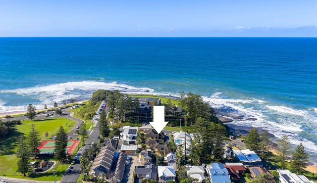 On little Austinmer beach encircled by resturants to surf,swim,fish, boat or ski