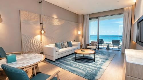 One-Bedroom King Suite with Oceanfront and Furnished Balcony