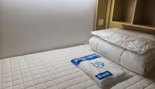 Single Bed in Dormitory Room