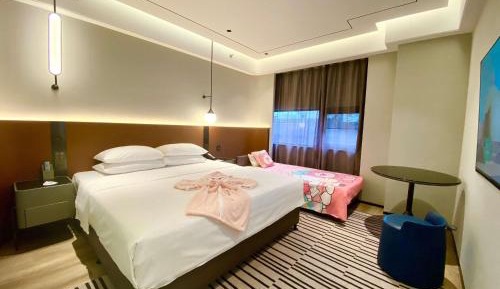 Family Suite with One King, One Queen Bed and Garden View