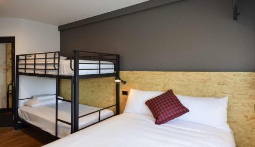 Standard Room with One Queen Bunk and One Set of Bunks