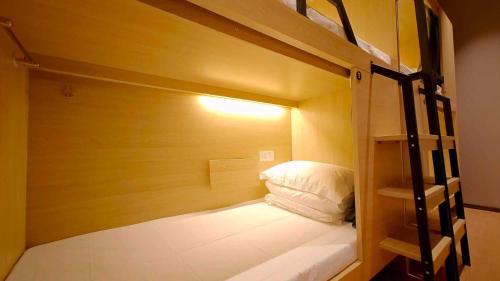 One bed in a 2-person female dormitory