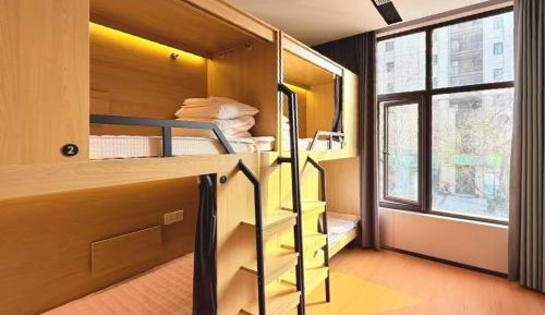 One bed in a 4-person male dormitory