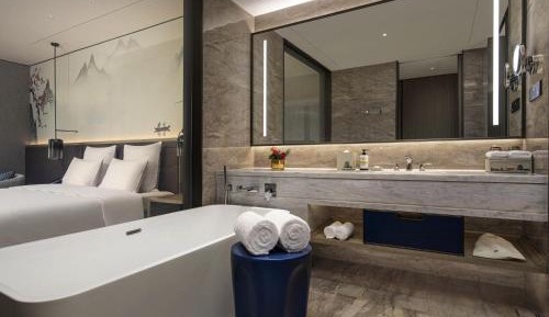 Deluxe Family Room with One King Bed and One Single Bed