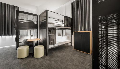 Bed in 6-Bed Male Dormitory Room with Shared Bathroom