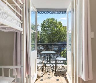 Mixed 2 Beds with Balcony and Shared Bathroom 
